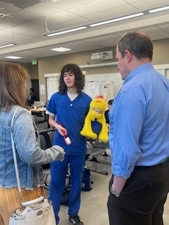 Kristin Cole, The Oregon Clinic HR Director; and Dr. Richard Jamison, The Oregon Clinic President with Benson High School MA Students