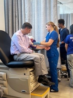 Tom Sanchez, The Oregon Clinic CEO with Benson High School MA Students